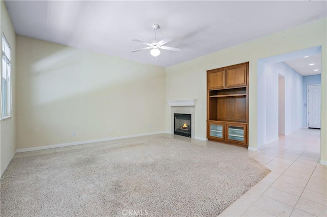 2612 Silverwood Way, Paso Robles, CA 93446 - unfurnished living room featuring a ceiling fan, light tile patterned floors, a fireplace with flush hearth, and baseboards