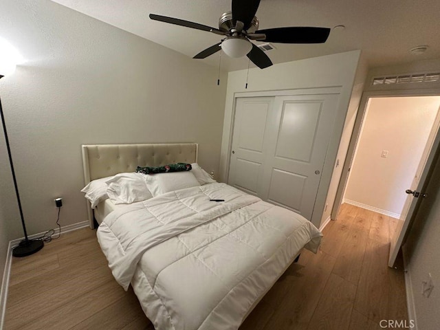 2511 Gunner Ridge Way, Rialto, CA 92377 - bedroom featuring wood finished floors, a closet, baseboards, and ceiling fan