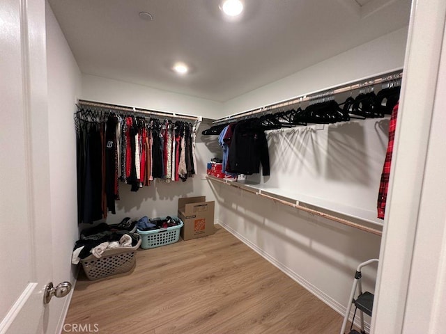 2511 Gunner Ridge Way, Rialto, CA 92377 - spacious closet featuring wood finished floors