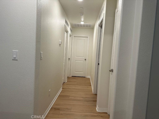 2511 Gunner Ridge Way, Rialto, CA 92377 - hallway featuring light wood-style flooring and baseboards
