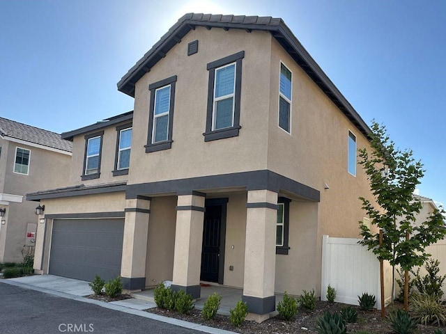 2511 Gunner Ridge Way, Rialto, CA 92377 - view of front facade featuring a garage, stucco siding, and fence