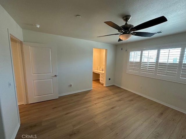 2511 Gunner Ridge Way, Rialto, CA 92377 - unfurnished bedroom with wood finished floors, baseboards, and ceiling fan