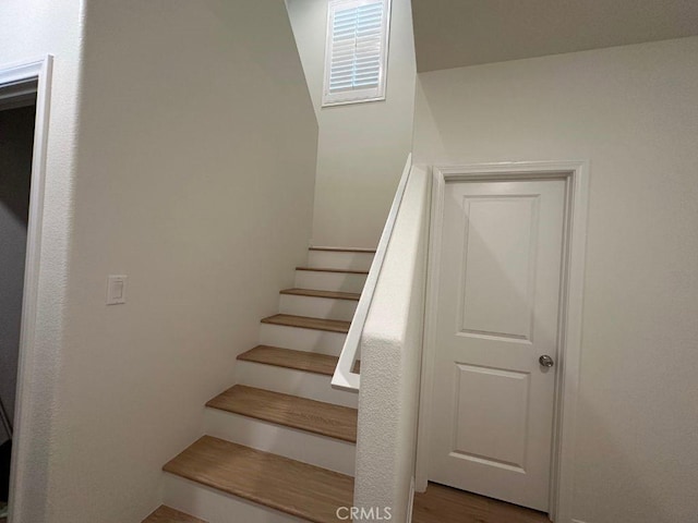 2511 Gunner Ridge Way, Rialto, CA 92377 - stairway featuring wood finished floors