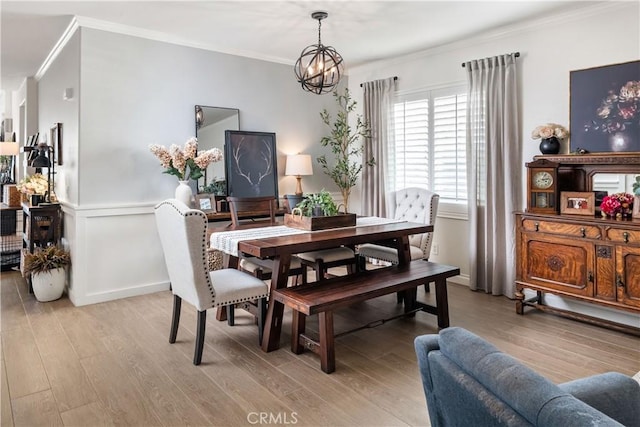 27975 Langley Pl, Castaic, CA 91384 - dining area featuring crown molding, light wood-style floors, and a chandelier