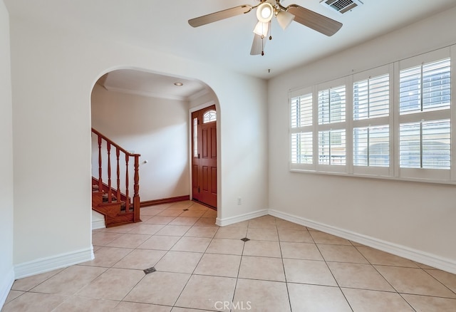 814 S Patton Ave Unit 2, San Pedro, CA 90731 - foyer entrance with arched walkways, stairway, baseboards, light tile patterned flooring, and ornamental molding