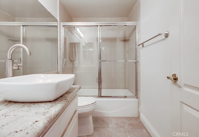 814 S Patton Ave Unit 2, San Pedro, CA 90731 - bathroom with vanity, combined bath / shower with glass door, toilet, and tile patterned flooring