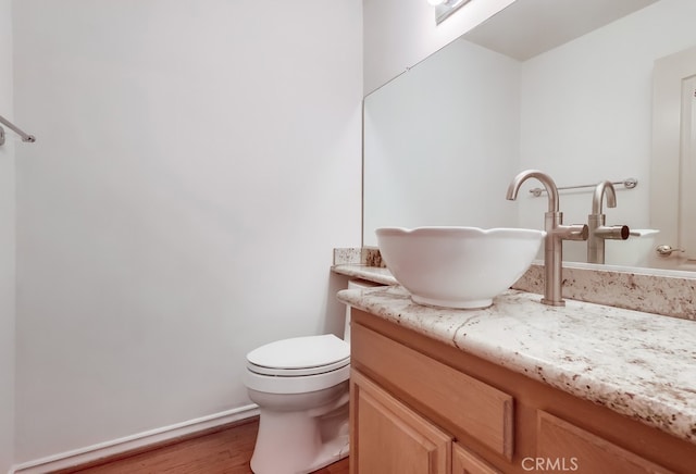 814 S Patton Ave Unit 2, San Pedro, CA 90731 - bathroom with wood finished floors, vanity, and toilet