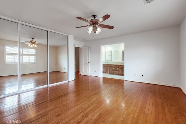 814 S Patton Ave Unit 2, San Pedro, CA 90731 - unfurnished bedroom with a closet, baseboards, light wood-style floors, ceiling fan, and ensuite bath