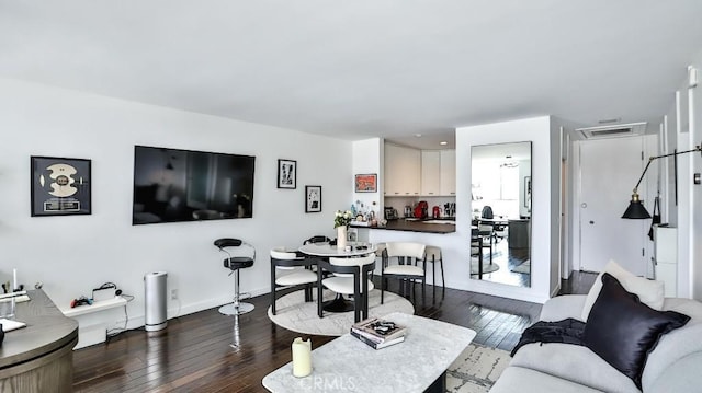 living room with wood-type flooring and visible vents