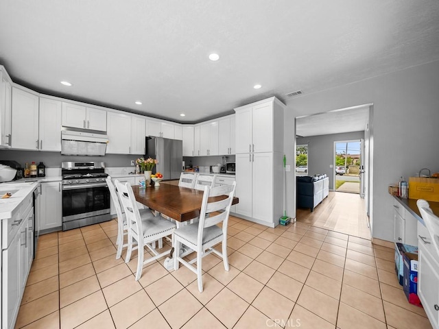 10478 Nutmeg St, Rancho Cucamonga, CA 91730 - kitchen featuring stainless steel appliances, visible vents, light tile patterned flooring, and recessed lighting