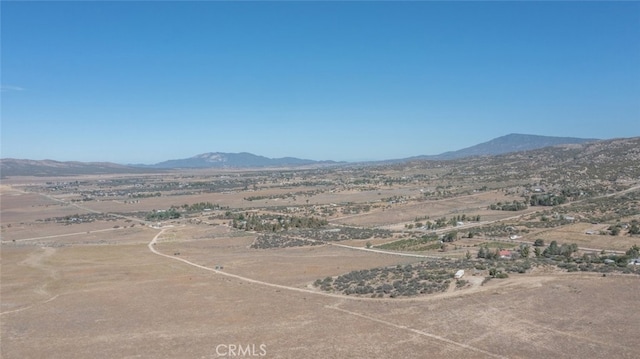 mountain view with a rural view and view of desert