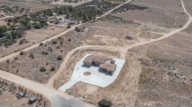 bird's eye view with a rural view and a desert view