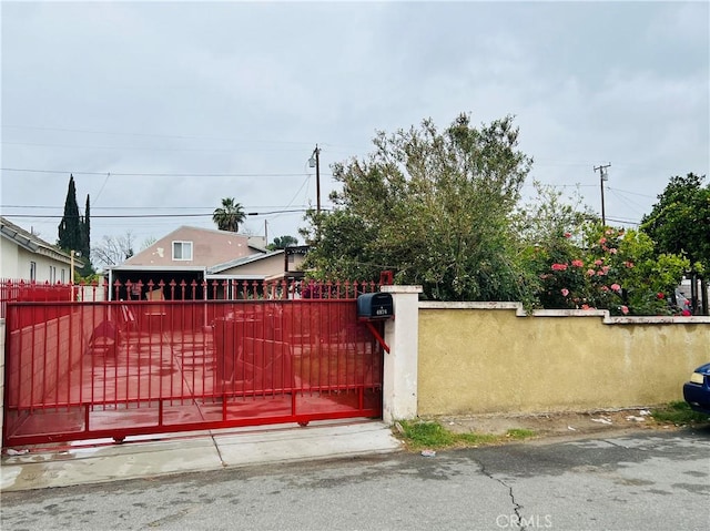 view of gate featuring a fenced front yard