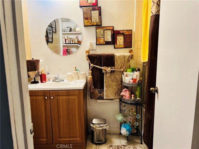 bathroom with vanity and tile patterned flooring