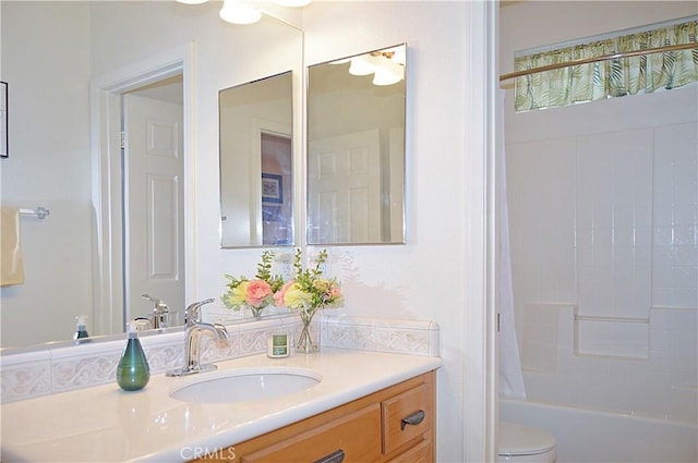 full bath featuring vanity, toilet, and shower / tub combo with curtain