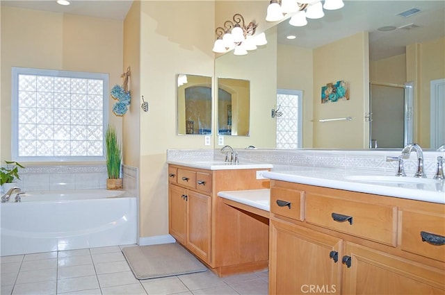 bathroom featuring a sink, tile patterned flooring, double vanity, a chandelier, and a stall shower