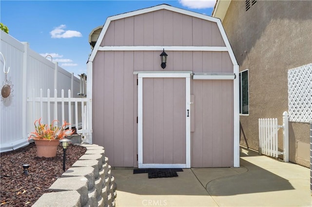 view of shed with a fenced backyard