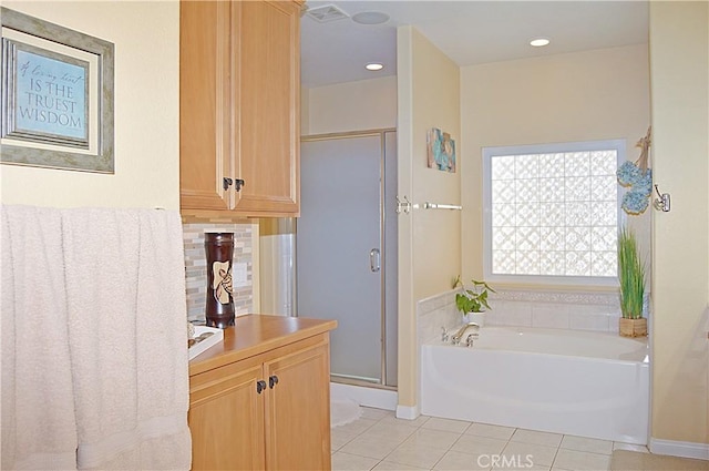 full bathroom featuring tile patterned flooring, baseboards, decorative backsplash, a shower stall, and a bath
