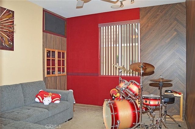game room with carpet floors and ceiling fan