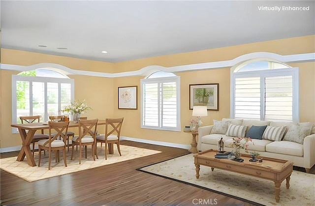 living room featuring baseboards and wood finished floors