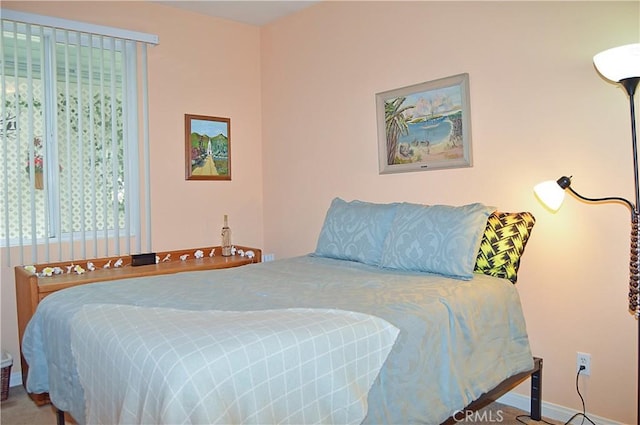 bedroom featuring baseboards