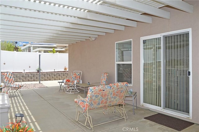 view of patio with fence, a pergola, and outdoor dining area