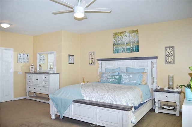 carpeted bedroom with baseboards and a ceiling fan