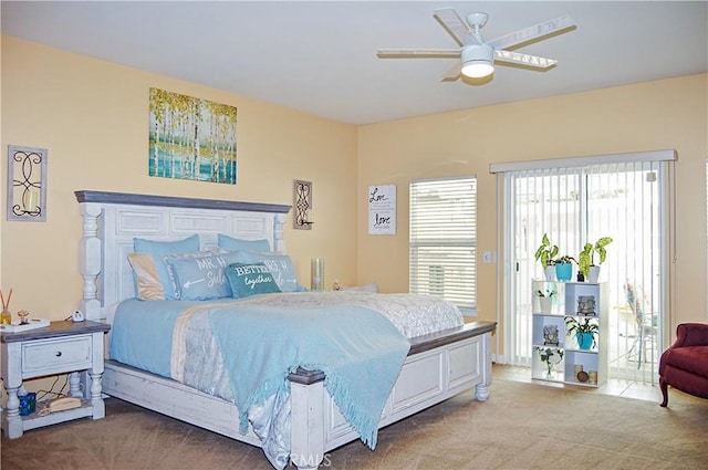 carpeted bedroom with access to outside