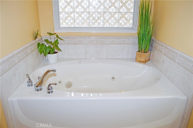 bathroom with a whirlpool tub