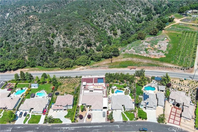 birds eye view of property with a wooded view