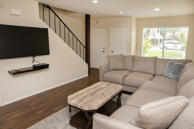 living room featuring baseboards, recessed lighting, and wood finished floors