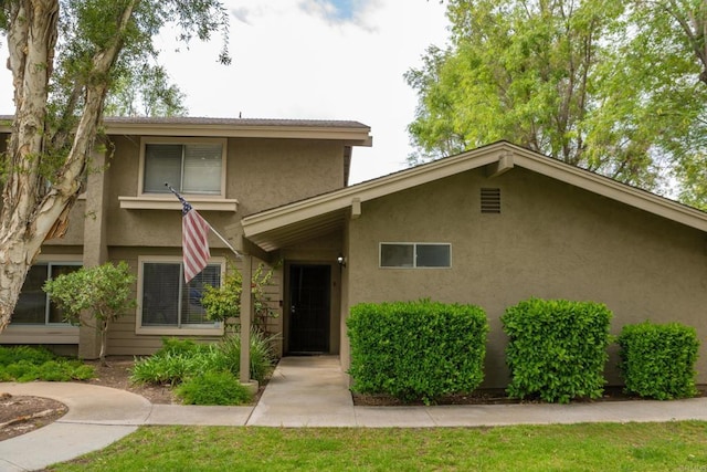 view of front of home featuring stucco siding
