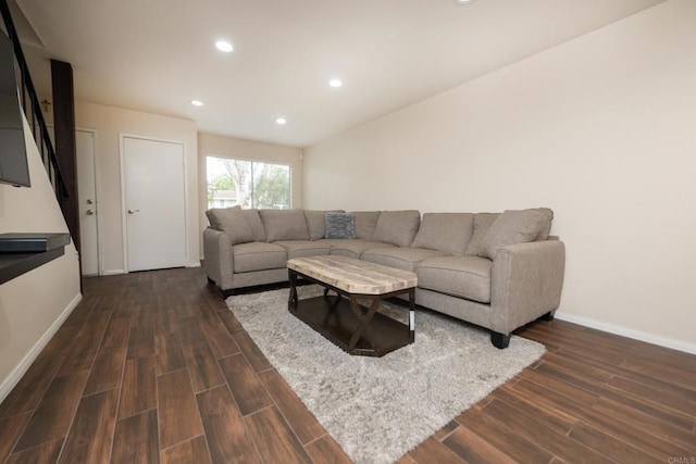 living room with recessed lighting, baseboards, and dark wood finished floors
