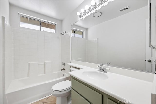 full bath featuring visible vents, tile patterned floors, vanity, toilet, and washtub / shower combination