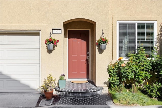 property entrance featuring stucco siding
