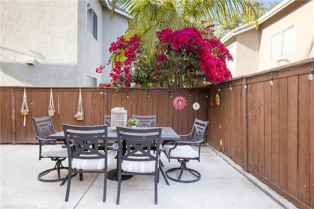 view of patio / terrace with a fenced backyard and outdoor dining space
