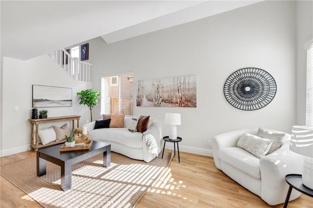 living room featuring baseboards and wood finished floors