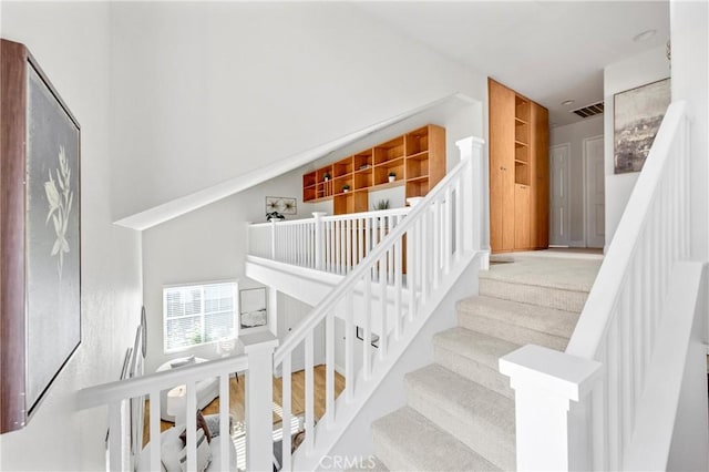 staircase with visible vents