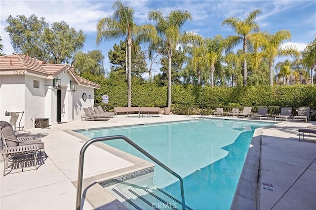 pool featuring a patio area