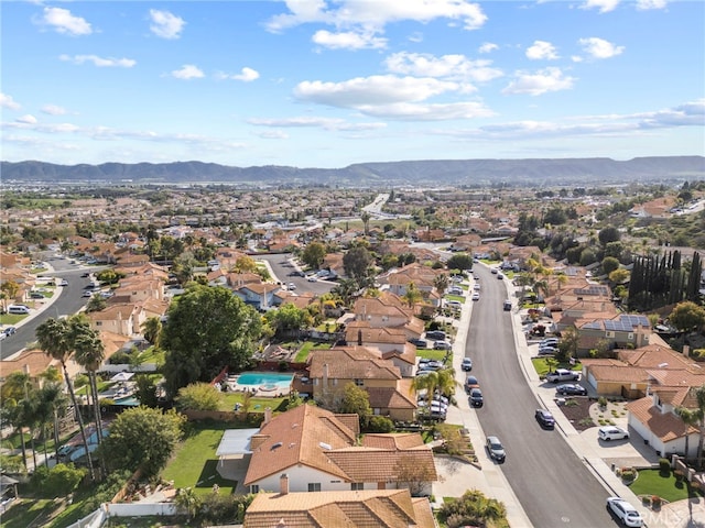 birds eye view of property featuring a mountain view and a residential view