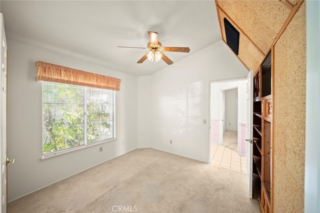 unfurnished bedroom featuring ceiling fan and carpet