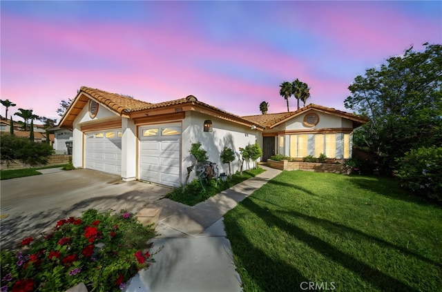 ranch-style home with a tiled roof, a garage, a front lawn, concrete driveway, and stucco siding