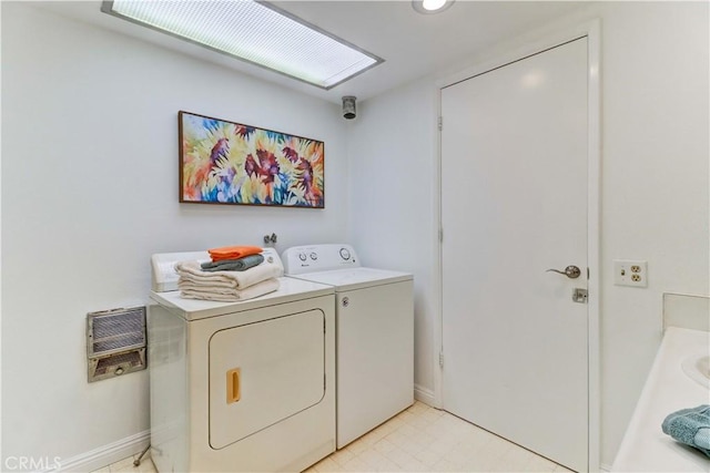 125 Via Estrada Unit B, Laguna Woods, CA 92637 - clothes washing area featuring washing machine and clothes dryer, laundry area, heating unit, and baseboards