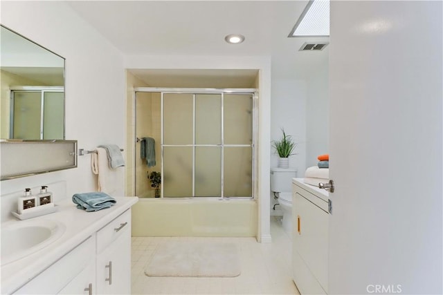 125 Via Estrada Unit B, Laguna Woods, CA 92637 - bathroom with vanity, toilet, tile patterned floors, enclosed tub / shower combo, and recessed lighting