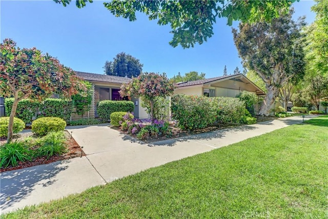 125 Via Estrada Unit B, Laguna Woods, CA 92637 - single story home featuring a front yard