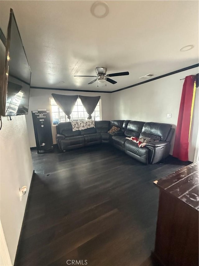 living area featuring ornamental molding, a ceiling fan, and wood finished floors