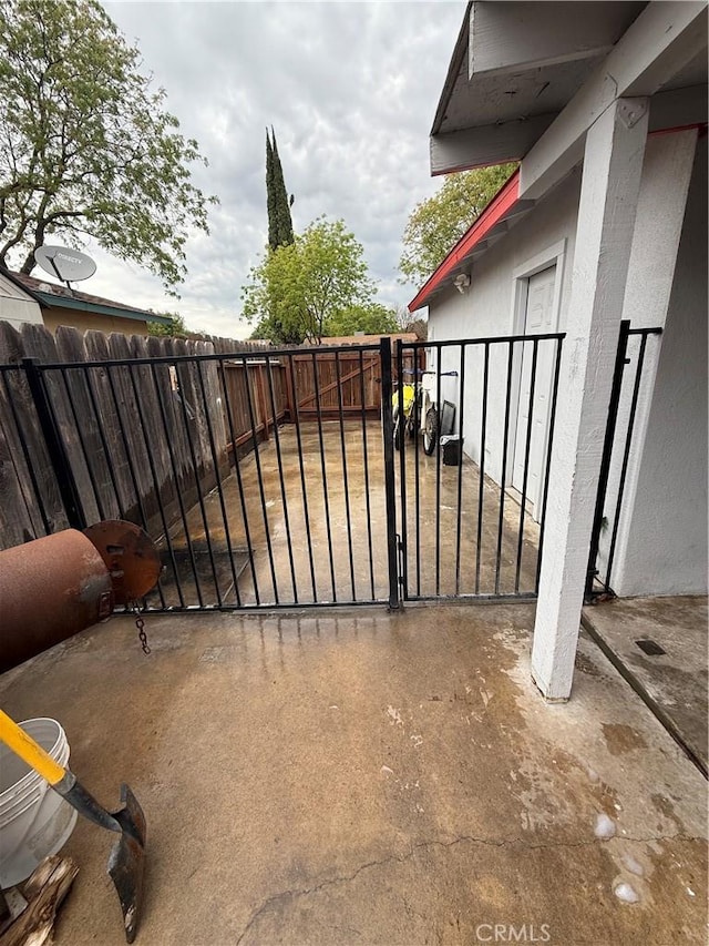 view of gate with fence