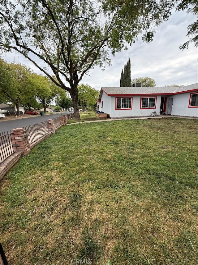 view of yard featuring fence