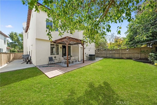 back of property with a lawn, central AC, a fenced backyard, and stucco siding