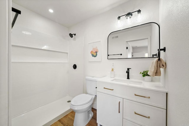 742 Eastshore Unit 98, Chula Vista, CA 91913 - full bathroom with toilet, wood finished floors, a tile shower, and vanity